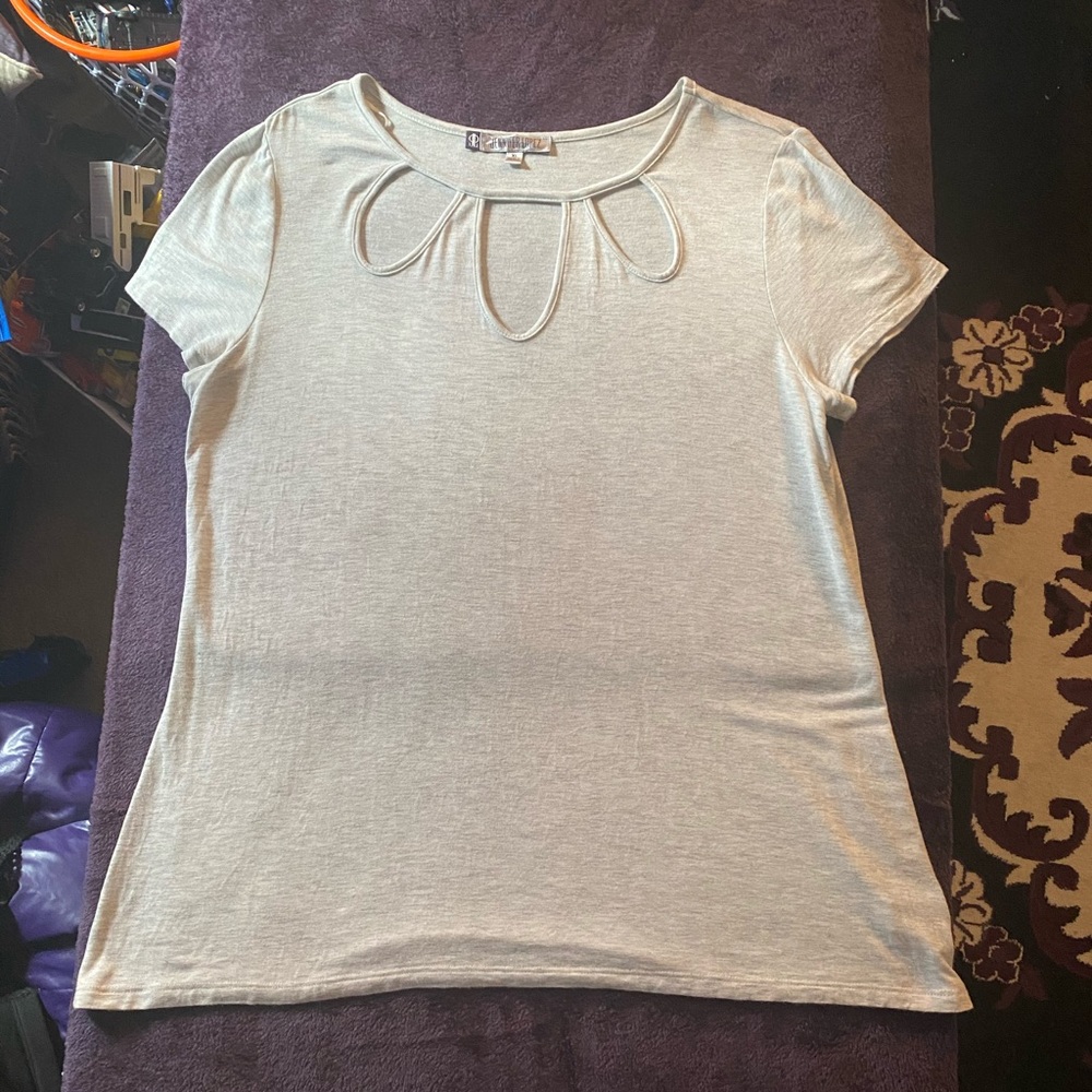 light color cutout blouse by Jennifer Lopez